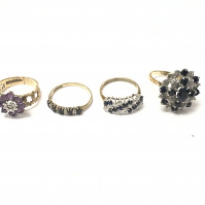 Four 9ct gold rings set with various stones. 12.88g Postage B
