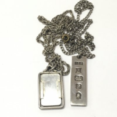 Two silver ingots on chains. 52.12g Postage B