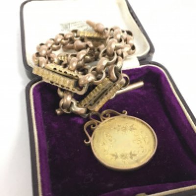 A 9ct gold watch chain with a 9ct gold pendant. 30.5g approximately. Postage category A