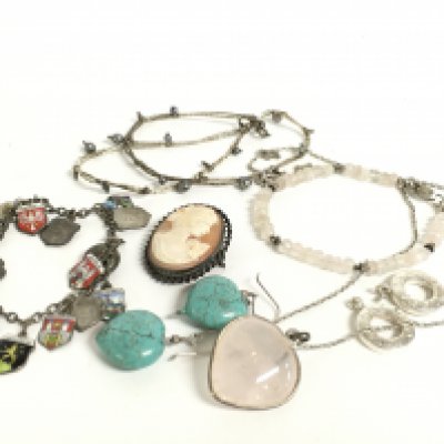 A collection of jewellery including a rose Quartz pendant, silver enamel charm bracelet, cameo etc. Postage category a