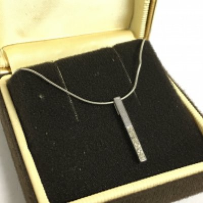 A white 9ct diamond set pendant on chain. Postage category A