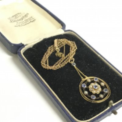A boxed gold sapphire and pearl set pendant on a 9ct chain. Total weight 5.8g Postage category A