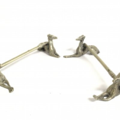 A pair of camel design knife rests. Postage category A