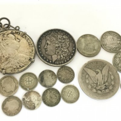 A collection of late 19th century and 20th century silver coins including a 1890 one dollar coin, 1887 Swiss franc etc. postage category A