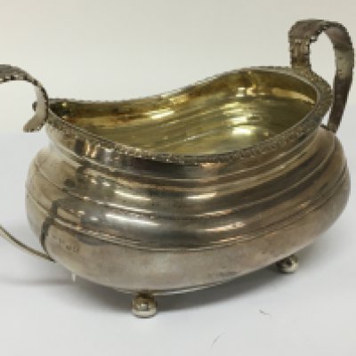 A George III silver sugar bowl the handles with stylised acanthus leaves London hallmarks 256g approximately.