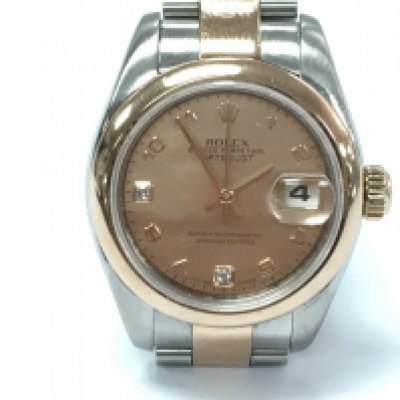 A ladies Rolex Datejust 26mm 179161 with pink mother of pearl dial set with two diamond markers. Rose gold and steel bracelet. Papers but no box. Seen running. Signs of wear on watch and some marks on glass.