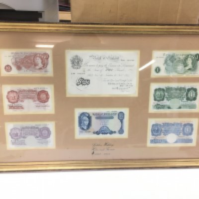 A frame containing bank notes including A 1944 White five pound note. Approx 46x76cm