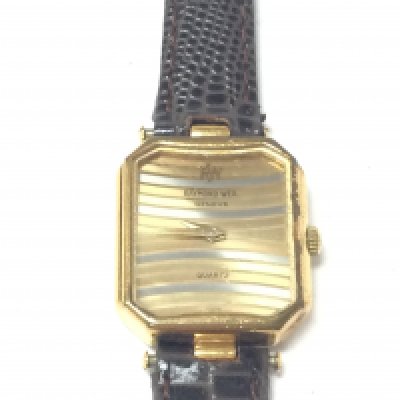 A vintage Raymond Weil tri colour ladies watch with box and papers. Model 5730 quartz movement (no seen running) 18ct gold plated. Circa 1970s.Postage B