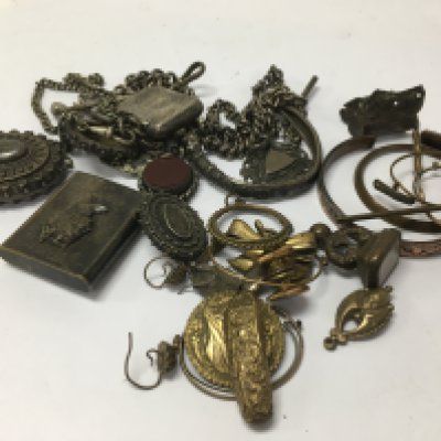 A mixed collection of silver items including Albert chains Vesta cases and other gold plated items.