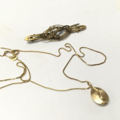 A 9ct gold pearl set bird brooch with a 9ct gold box chain and coffee bean pendant and two cut 15ct bands and one cut 9ct gold band and one 9ct gold earring Approx weight 10.45 grams.