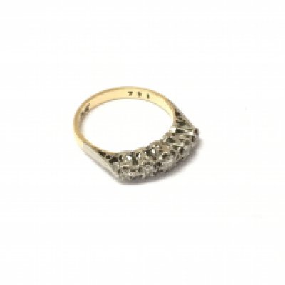 An 18ct gold And platinum five stone set diamond ring, approx weight 2.53 grams.