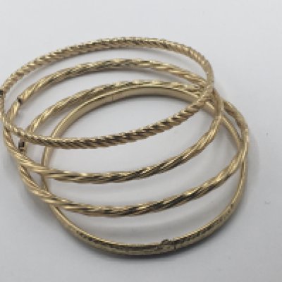 A collection of four 9carat gold bangles. Weight 16g.