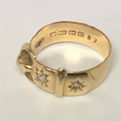 An 18carat gold buckle ring set with two diamonds weight 5.5g