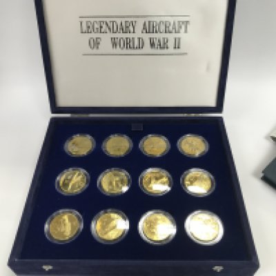 A collection of commemorative coins as well as some sets and loose coins.