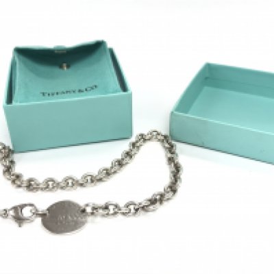 A boxed silver Tiffany and Co necklace. Postage category A