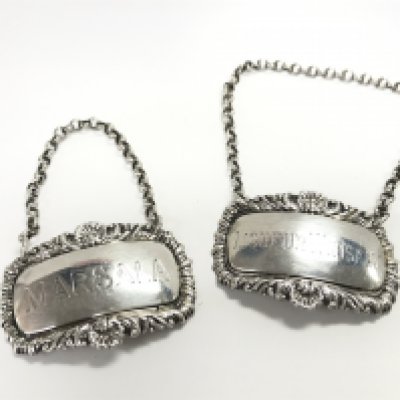 Two Georgian silver decanter labels. Postage category a