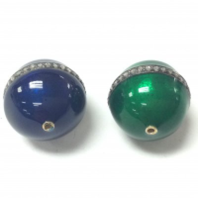 A pair of diamond and enamel beads one blue and one green. Both set with a line of diamonds approx 0.30ct total. Postage A