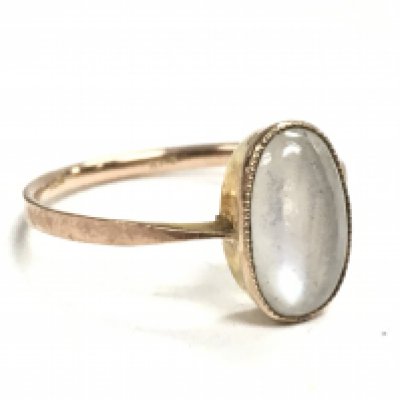 A 9ct gold ring set with a moonstone , size N Postage category A