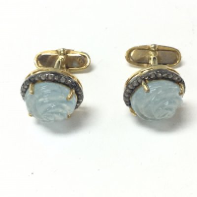 A pair of rose carved aquamarine and R/C diamond cufflinks in yellow metal with box. aquamarine 3.41ct and diamonds 0.55ct approximately. Postage B