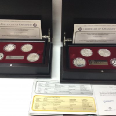 Two sets of fifa centennial silver coins with COAS. Postage B