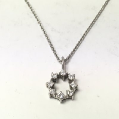 An 18ct white gold chain with 18ct white gold and diamond pendant. 4.85g