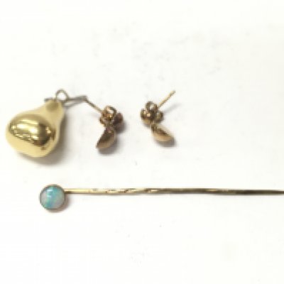 A 9ct gold stick pin set with opal and two yellow metal items. Postage A