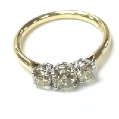 An 18ct yellow and white gold graduated diamond trilogy ring with certs. Ring size M and 2.88g Postage A