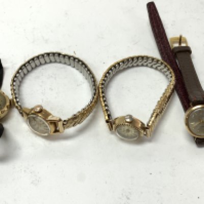 Four gold cased ladies wristwatches. Postage category A.