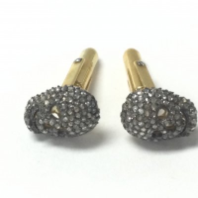 A pair of gold plated silver skull cufflinks set with rose cut diamonds. Diamonds approx 1.80ct total. Postage A