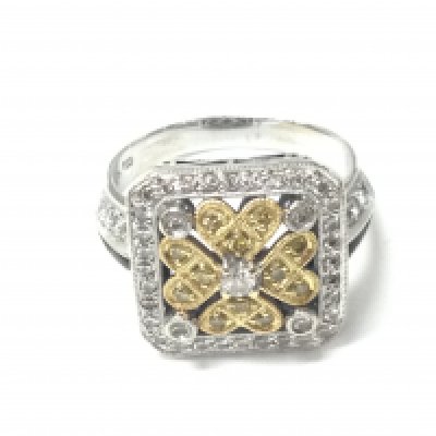 An 18ct yellow and white gold regency style dress ring set with white and yellow RBC diamonds totalling 1ct with certificate. Size R 1/2.