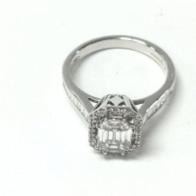 An 18ct white gold baguette and RBC diamond cluster ring with diamond set shoulders. Diamonds approx 0.81ct and size N. Postage A