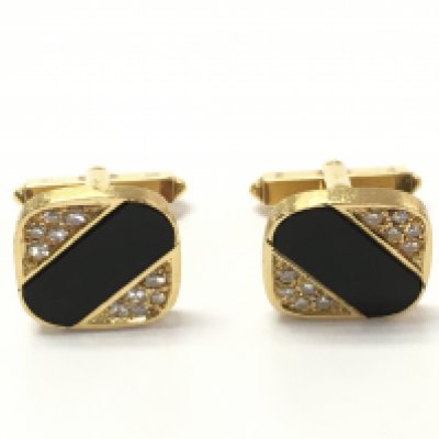 A pair of 18ct gold onyx and diamond cufflinks. 13.8g