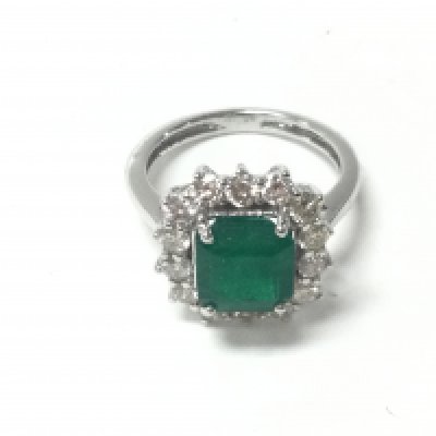 An 18ct white gold ring set with an emerald cut emerald and a halo of RBC diamonds. Emerald 2.82ct and 1.05ct diamonds approx. Size N and 5g. Postage B