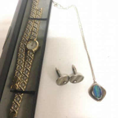 A pair of silver cufflinks set with small diamonds a modern design silver pendent set with an Opal doublet and attached silver chain and a ladies watch.