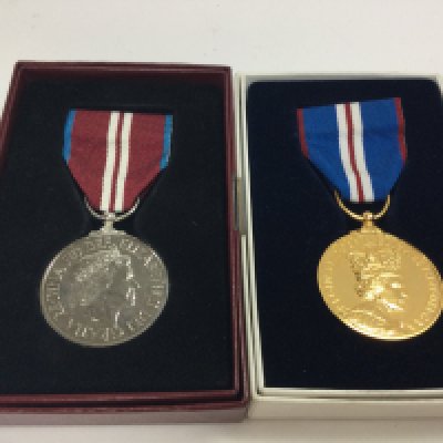 A pair of boxed Elizabeth II jubilee medals. Postage category A