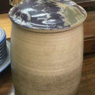 A ceramic stone ware barrel with a removal top. 36cm tall approximately. This lot cannot be posted