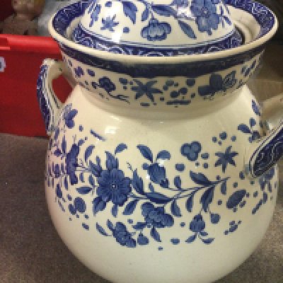 A large blue and white twin handle blue and white jar and cover decorated with flowers and foliage. NO RESERVE