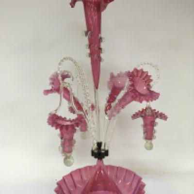 An exceptional Victorian opaque and cranberry glass epergne with hanging baskets and three trumpet flutes with shaped edges no obvious damage Hight 64cm