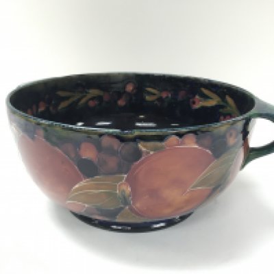 Bowl by William Moorcroft Pomegranate circa 1947/1953. 25cm diameter. Chip to rim. Postage D