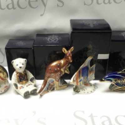 Four boxed porcelain Royal Crown Derby figures, one unboxed. No obvious damage or restoration, this lot cannot be posted