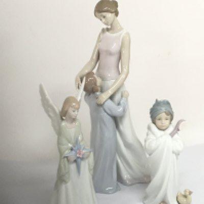 Three Lladro figures a large figure group of a mother and child Hight 36cm an angle holding a star and bed time bath a figure of a child with small duck at foot no obvious damage.