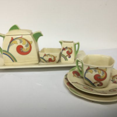A Royal Doulton Art Deco Ceramic Bachelor tea set some slight damage inside edge of tea pot sugar bowl
