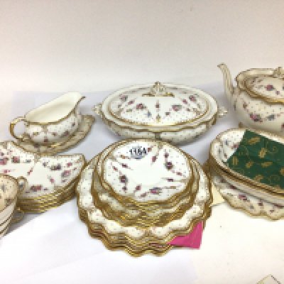 A Royal Crown Derby fine Porcelain part dinner service Royal Antoinette pattern comprising an oval tureen and cover a large tea pot two open serving dishes four hors d&rsquo;oeuvre dishes sauce boat and stand serving plate five dinner plates four side plates four soup bowls with dishes no obvious damage in need of a clean.