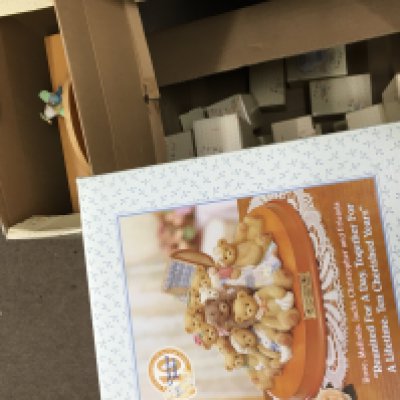 A collection of Enesco Cherished teddies including a display case, a large Cherished Retailer figure group, a collection of boxed individual figures etc