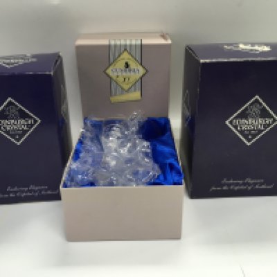 A box of glass decanters including some Edinburgh crystal. Shipping category D