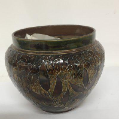 A Lambeth Doulton stoneware jardiniere decorated with impressed leaves no damage or restoration height 19cm.