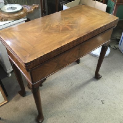 A fine quality late George III folding games table with an inlaid top And sides, approx 86cm x 42cm x 74cm when closed, the top measuring 84cm x 84cm when opened. Shipping category D.