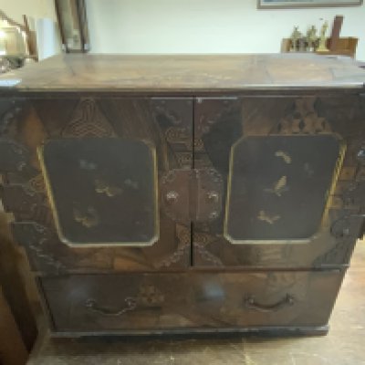 A Japanese parquetry collectors cabinet with lacquered panels and metalwork mounts. 48cm x 44cm x 28.5cm.