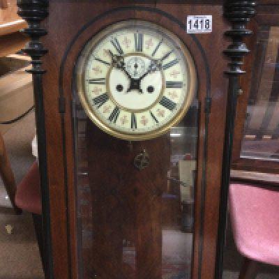 A mahogany wall clock with double weight the dial with Roman numerals
