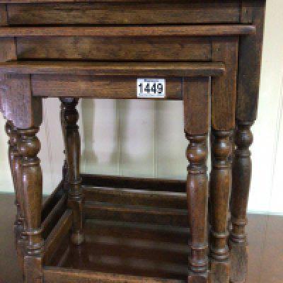 A nest of three oak tables with turned legs